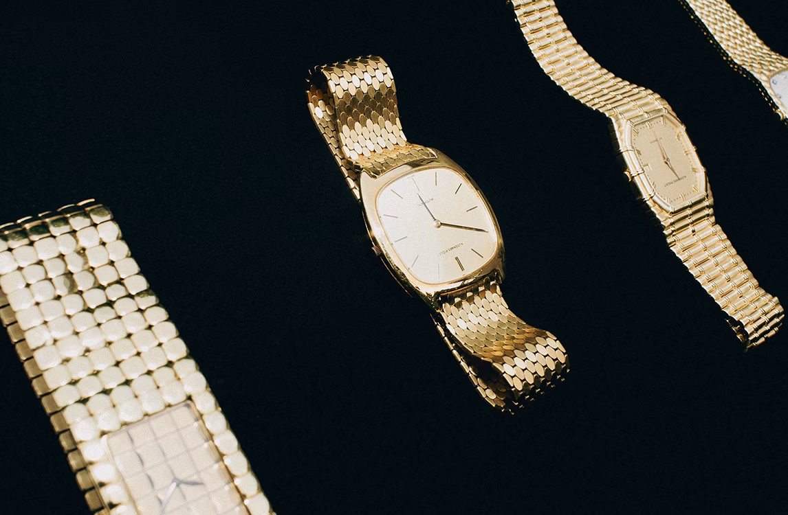 Three gold vintage Audemars Piguet watches on a black background, including the Cobra model (left) and the Bamboo model (right), with an oval-cased watch in the center.