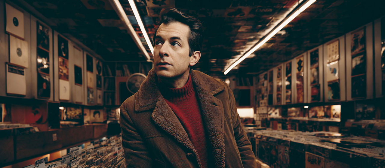 Portrait of Mark Ronson in a record store.