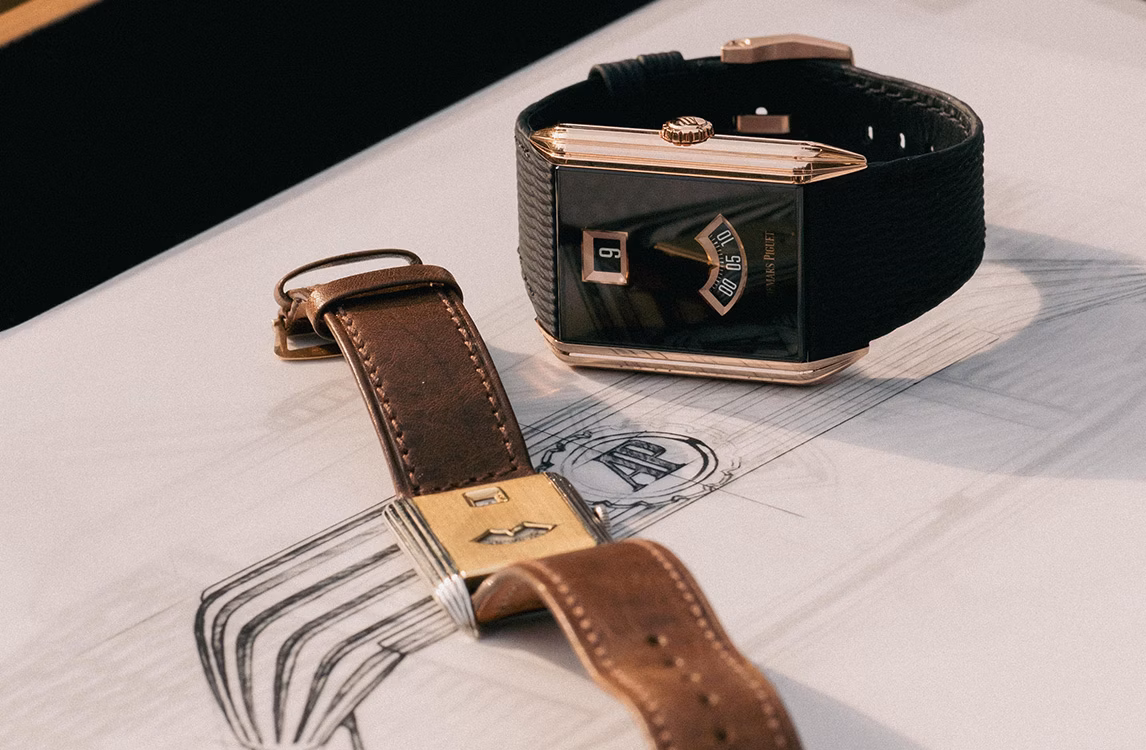 Audemars Piguet Neo Frame 2026 watch with a black dial, next to the brown leather strap of an Art Deco Jumping Hour 1926, on a design sketch.