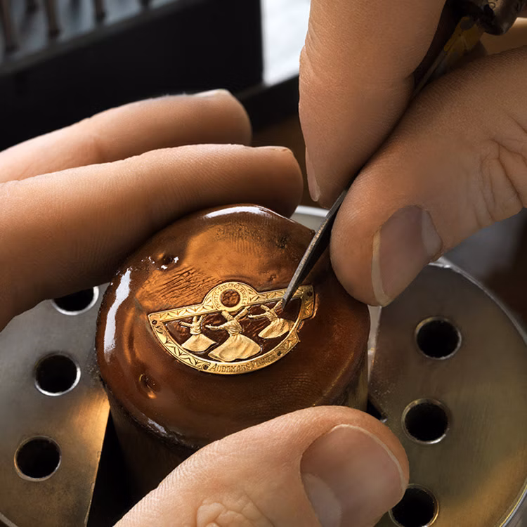 Engraver working at the Métiers d'Art Atelier in the museum Musée Atelier Audemars Piguet, Le Chenit, Switzerland.