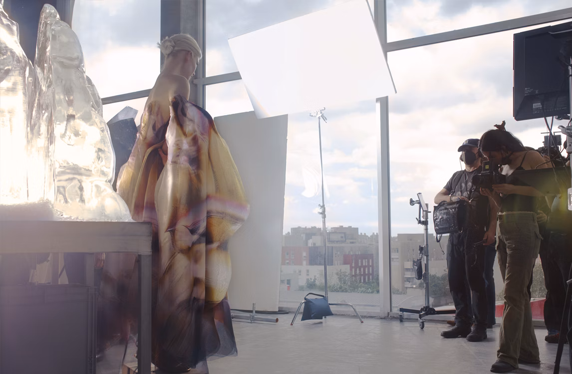 Harley Weir photographing a model wearing a Royal Oak Frosted Gold Double Balance Wheel Openworked