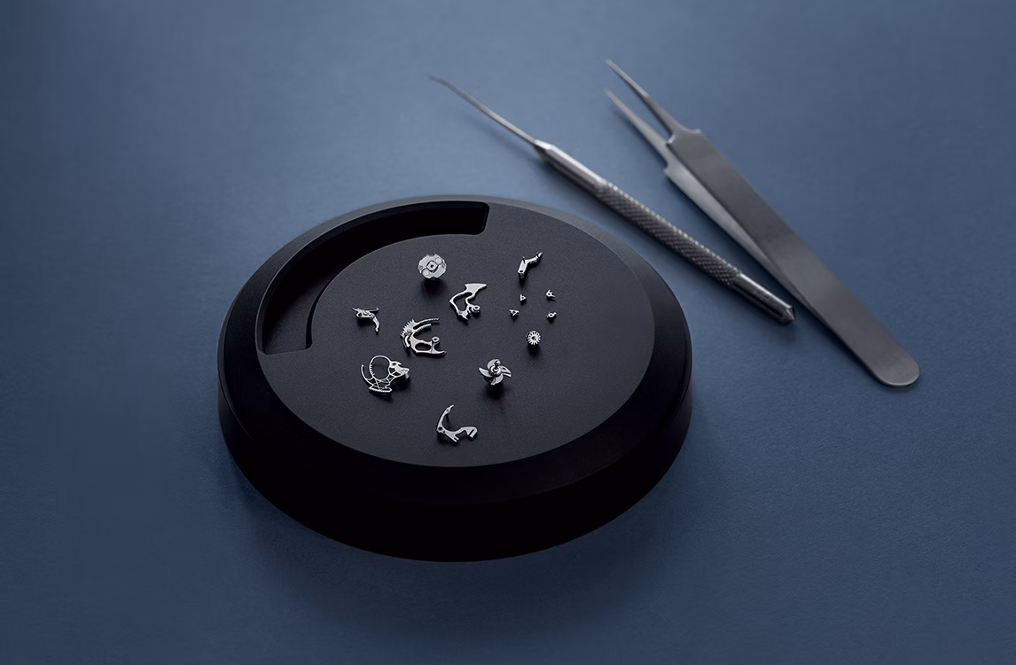 The working tools of a watchmaker on a table.