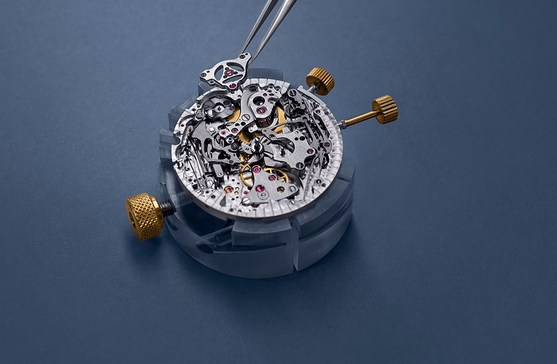 A watch being assembled by a watchmaker.