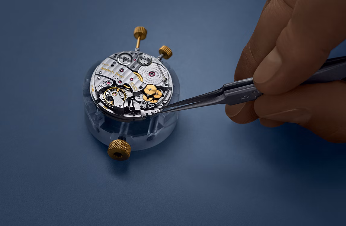 A watch being assembled by a watchmaker.