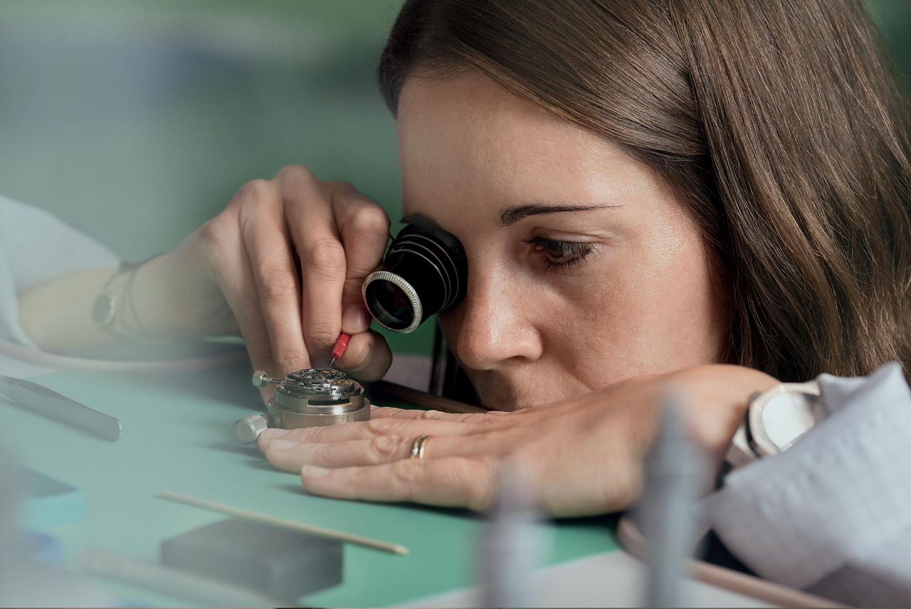 A watchmaker working on a workshop.